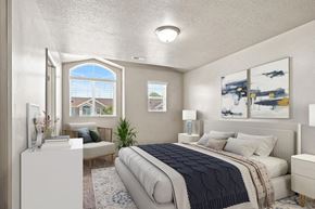 Layton townhouse for rent - an open bedroom with a bed and a window