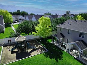 Layton townhouse for rent - a aerial view of a backyard with a playground and houses