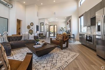 St. George townhouse for rent - A modern living room with a dark brown sofa and a wooden coffee table.