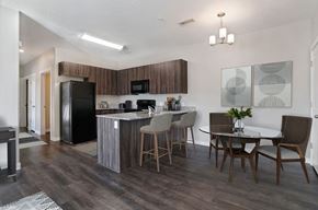 St. George apartment for rent - A kitchen with a black fridge and a white counter top.