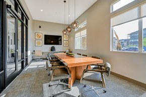 St. George apartment for rent - a large conference room with a beautiful wooden table and chairs at Brookfield Apartments for rent in St. George, UT. d