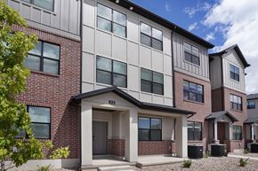 Riverdale townhouse for rent - A modern two-story building with a mix of brick and siding exterior.