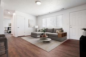 Roy apartment for rent - a living room with a couch and a coffee table