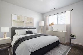 Roy apartment for rent - an example of a bedroom with a bed and a window