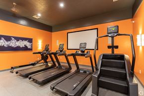 Springville apartment for rent - A gym with treadmills and a digital display.