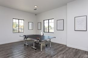 Tooele apartment for rent - A room with a pool table and pictures on the wall.