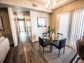 Tooele apartment for rent - A dining room with a wooden table and chairs.