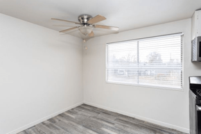 Salt Lake City townhouse for rent - A room with a ceiling fan and a window with blinds.