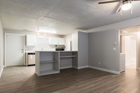 Bountiful apartment for rent - A kitchen with a white counter top and a white fridge.