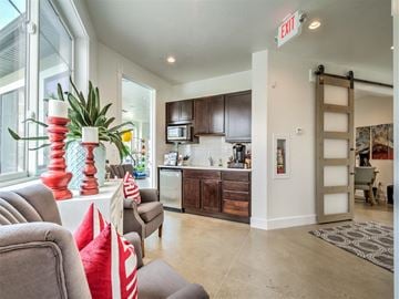 Roy apartment for rent - a living room with a couch and a kitchen