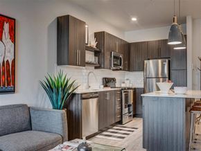 West Jordan apartment for rent - a kitchen with stainless steel  appliances and a counter top  at Affinity 56 Apartments in West Jordan, Utah