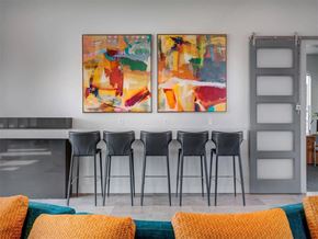 West Jordan apartment for rent - a dining room with chairs and paintings on the wall  at Affinity 56 Apartments in West Jordan, Utah