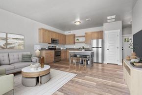 Idaho Falls townhouse for rent - A modern kitchen with wooden cabinets and a large island.
