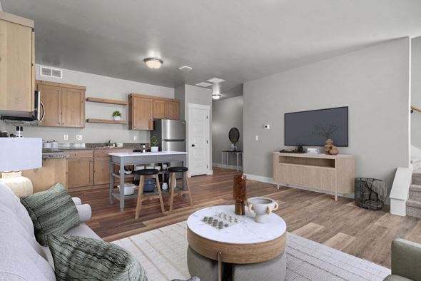 Idaho Falls townhouse for rent - A modern living room with a grey couch and a wooden coffee table.