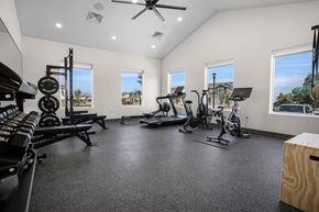 Tooele townhouse for rent - A spacious home gym with a variety of exercise equipment.