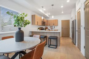 Ogden apartment for rent - a kitchen and dining area with a table and chairs