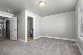 Idaho Falls townhouse for rent - a bedroom with a closet and a door to a bathroom