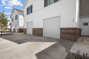 Idaho Falls townhouse for rent - a white garage door on the side of a building
