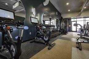 St George apartment for rent - a gym with various exercise bikes and weights