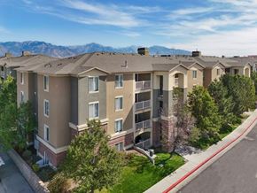 West Valley City apartment for rent - Apartment complex with a mountain range in the background.