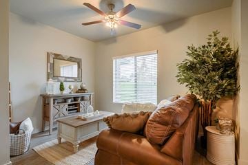 Clearfield apartment for rent - a living room with a couch and a ceiling fan