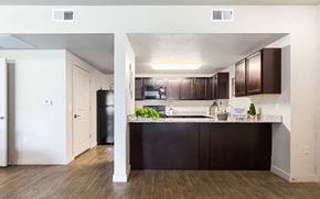 Clearfield apartment for rent - a kitchen with dark wood cabinets and a white counter top