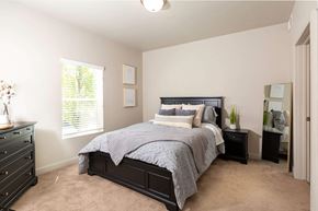 Magna apartment for rent - a bedroom with a large bed and two night stands