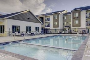 West Haven apartment for rent - A swimming pool in front of apartment buildings.