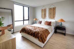 Boston apartment for rent - a bedroom with white walls and hardwood flooring