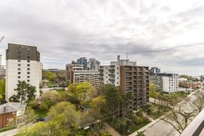 Mississauga apartment for rent - A cityscape with buildings and trees in the foreground.
