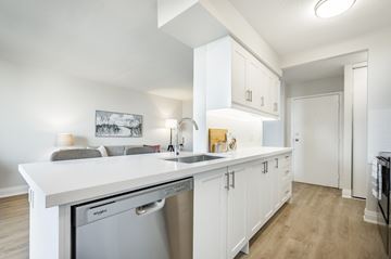 Hamilton apartment for rent - A kitchen with white cabinets and a white counter top.
