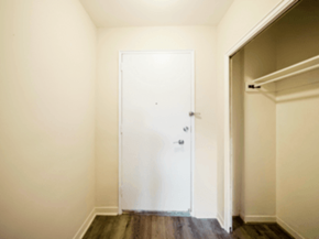 Brampton apartment for rent - A white door is in a room with a wooden floor.