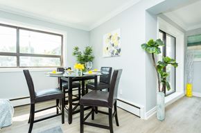Hamilton apartment for rent - A dining room with a table set for four.