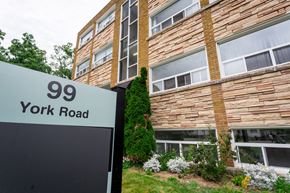 Hamilton apartment for rent - A building with the number 99 on a sign in front of it.