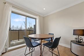 Brampton apartment for rent - A dining room with a table and chairs and a view of the outside.