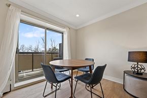 Brampton apartment for rent - A dining room with a table and chairs and a view of the outside.