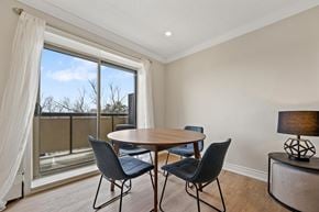 Stoney Creek apartment for rent - A dining room with a table and chairs and a view of the outside.