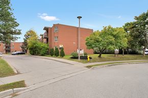 Cambridge apartment for rent - A street view of a residential area with apartment buildings.