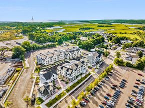 Scituate apartment for rent - an aerial view of houses and cars in a parking lot
