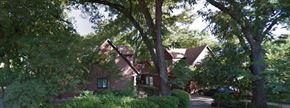 Austin apartment for rent - a house surrounded by trees and bushes