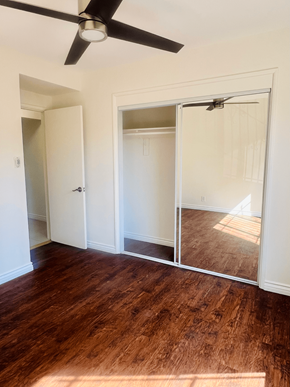 West Hollywood apartment for rent - an empty bedroom with a closet and a ceiling fan