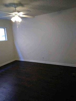 Los Angeles apartment for rent - an empty room with a ceiling fan and a window