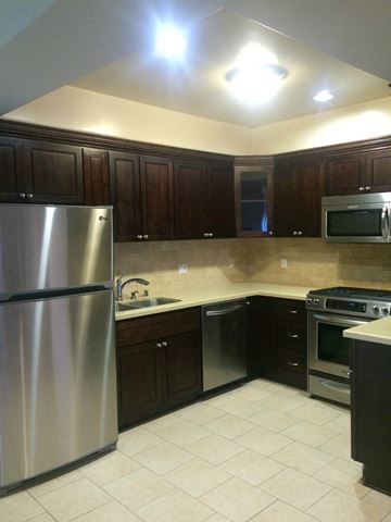 Studio City apartment for rent - a kitchen with a stainless steel refrigerator and a sink