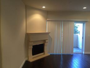 Studio City apartment for rent - a living room with a fireplace and a sliding glass door