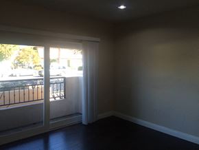 Studio City apartment for rent - an empty living room with a large window and a balcony