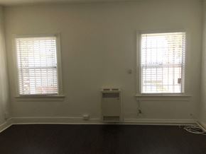 Los Angeles apartment for rent - an empty room with two windows and an air conditioner