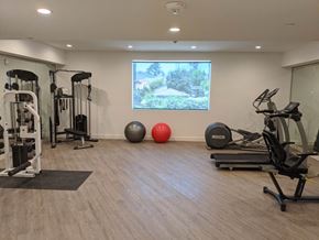 Studio City apartment for rent - a gym with exercise equipment and a large window