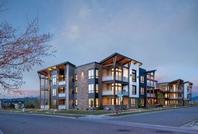 Bozeman apartment for rent - a rendering of an apartment building on a city street