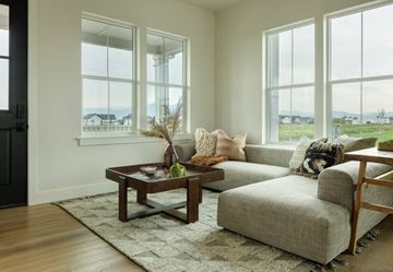 Bozeman apartment for rent - A living room with a grey couch and a coffee table.
