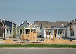 Bozeman apartment for rent - a playground in front of a group of homes